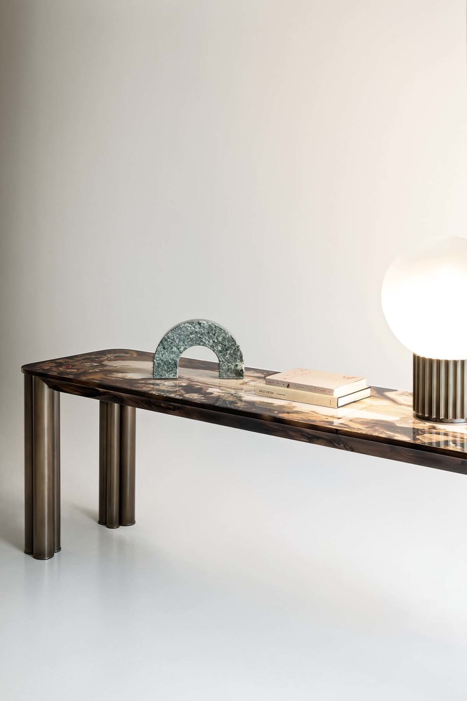 Forest console | Rugiano. Elegant console with filigree metal legs and a top available in wood, marble, or leather.