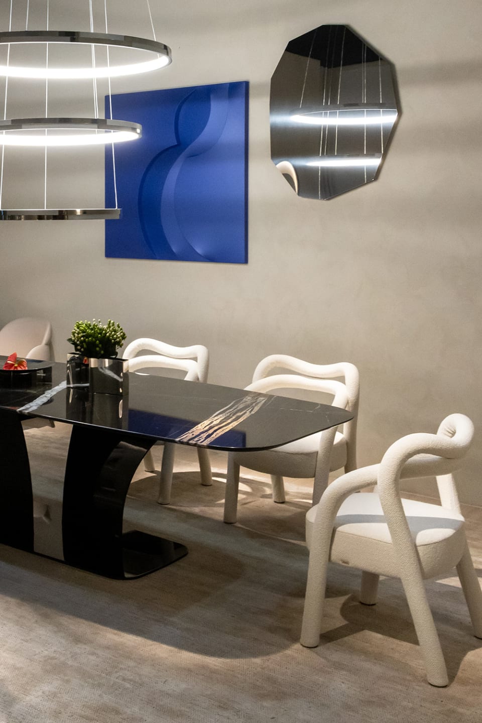 Spectro table | Rugiano. Exquisite dining table with a monumental marble top and elegant curved base, embodying modern luxury.
