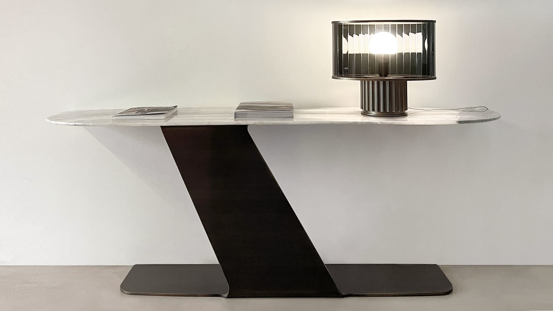 Wally console | Rugiano. Exquisite console with a marble top and unique geometric metal base.