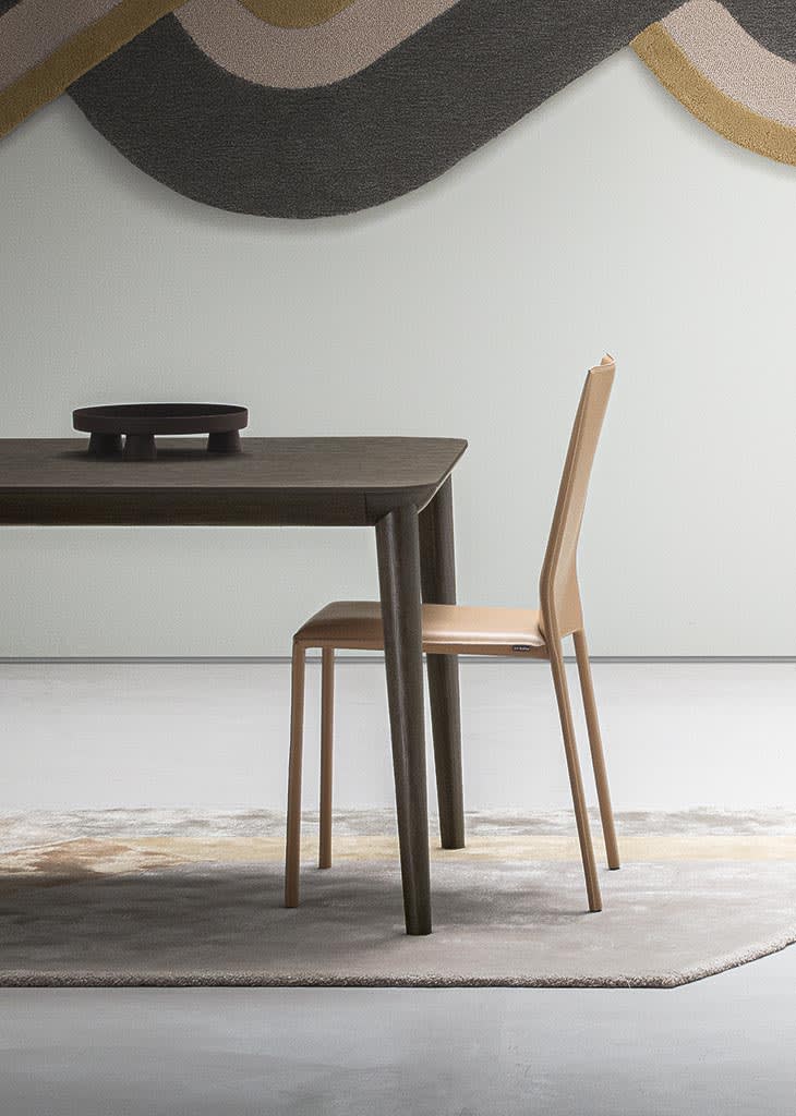 Corium chair | ALF Dafre. Compact designer chair with leather, fabric upholstery options and two backrest heights.
