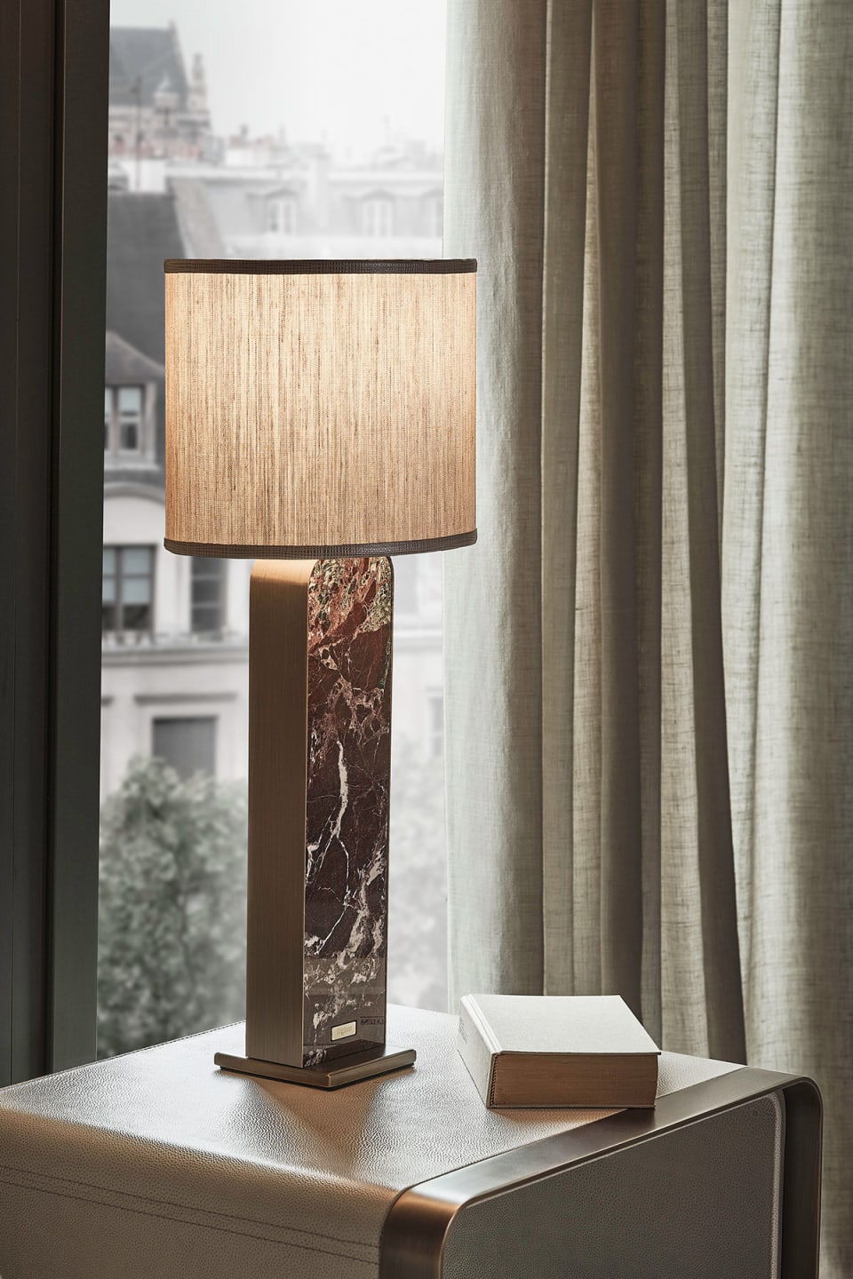 Bagutta bedside lamp | Rugiano. Exquisite lamps featuring bronze/steel frames, leather upholstery, and marble bases.