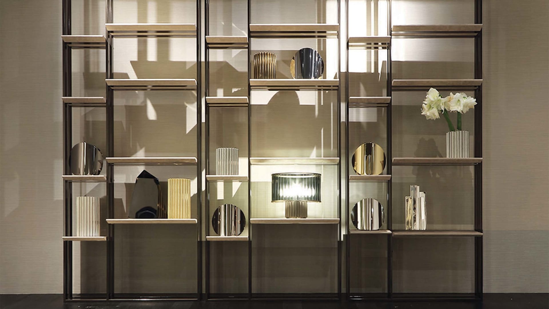 Frame bookcase | Rugiano. A versatile modular shelving system with luxurious finishes, offering customisable storage solutions for any sophisticated interior.