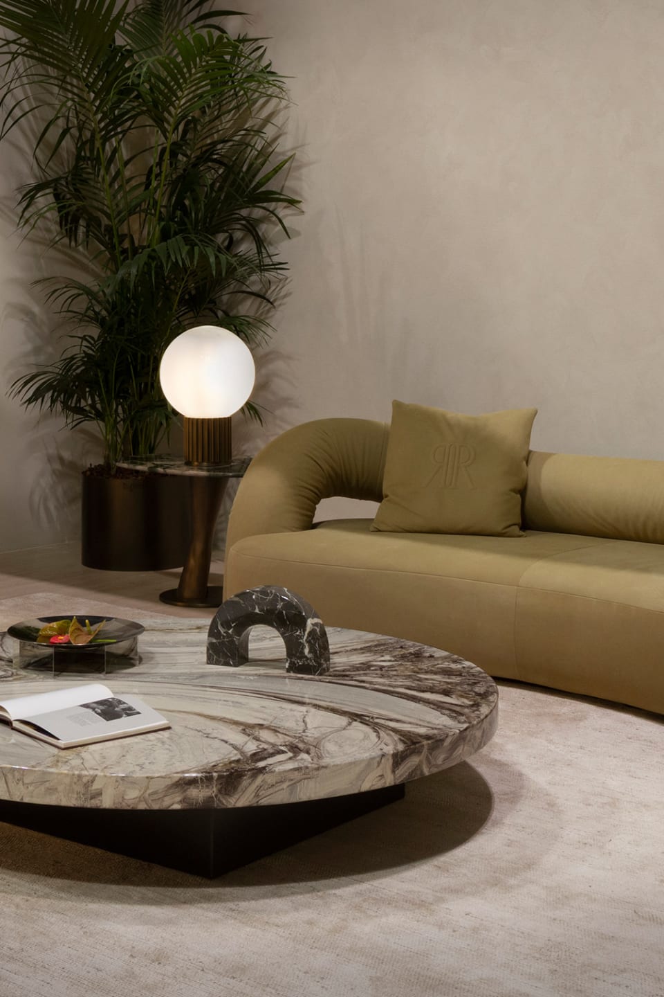 Abbraccio sofa | Rugiano. Curved sofa with an enveloping design, offering exceptional comfort and modern aesthetics.