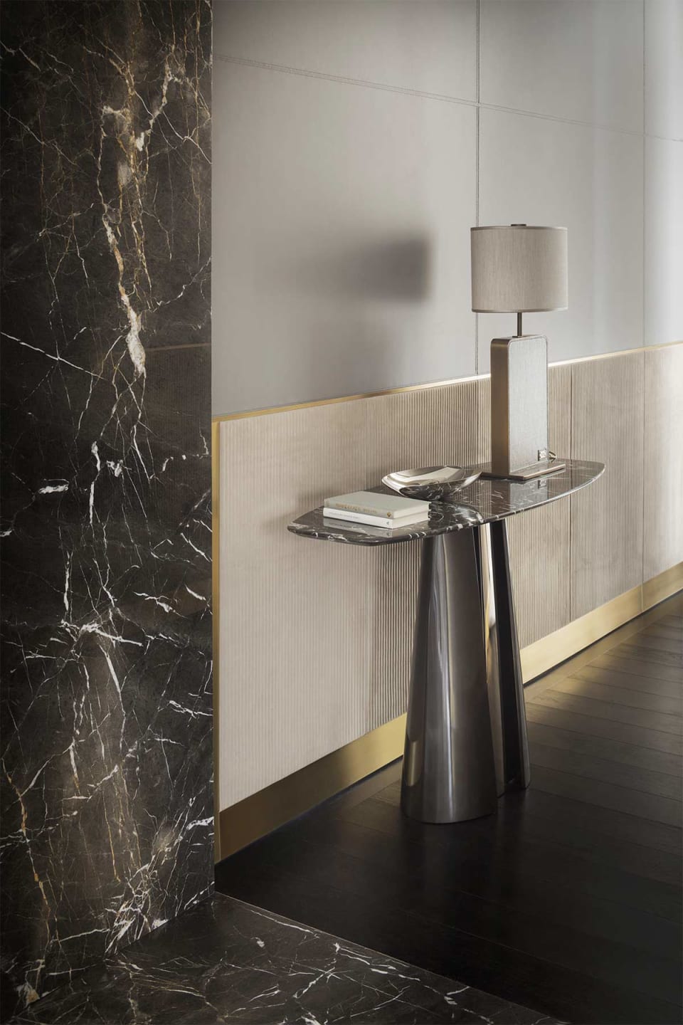 Absolute console | Rugiano. Elegant console with a striking sculptural metal base and a versatile top in various luxurious finishes.