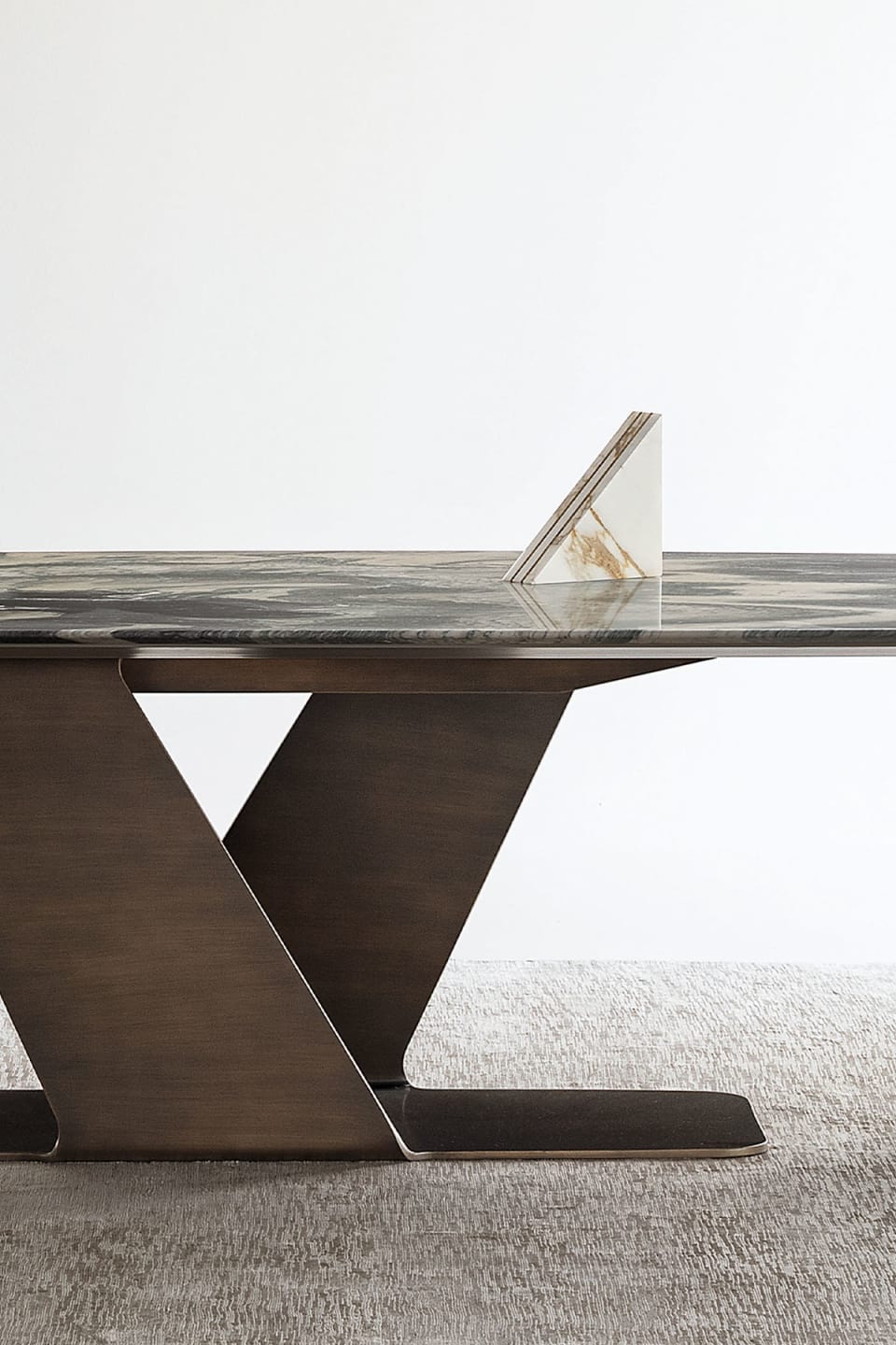 Wally table | Rugiano. A masterpiece of design, featuring a sculptural base and exquisite natural stone top, enhanced by distinctive decoration.