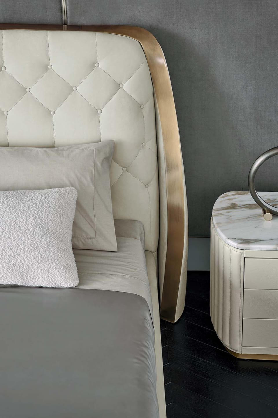 Damasse bed | Rugiano. Luxurious upholstered bed with a distinctive geometric headboard and sturdy metal frame.