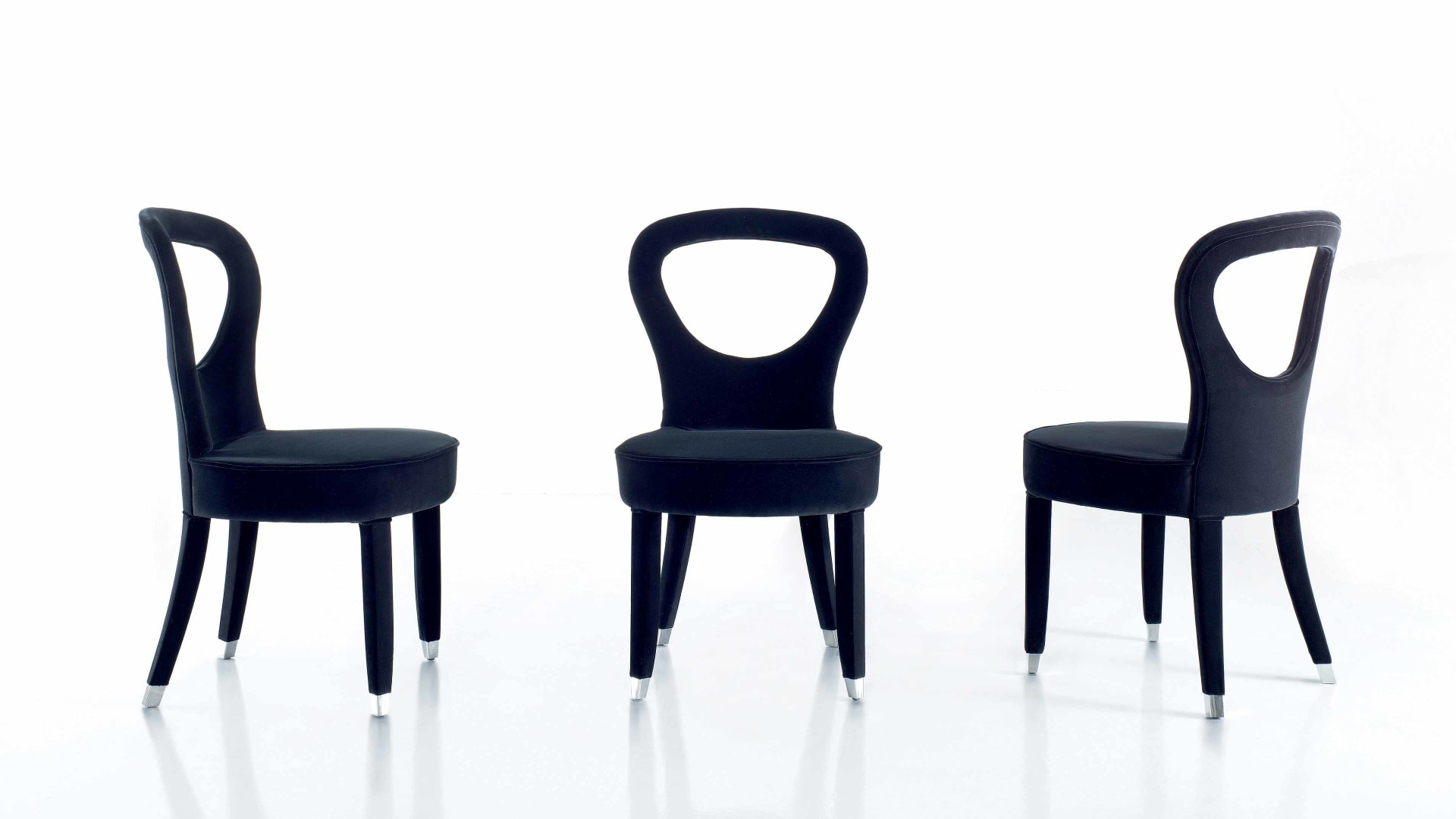 Dolly chair | Rugiano. Elegant dining chair with a curved backrest and soft seat, offering exceptional comfort and refined style.