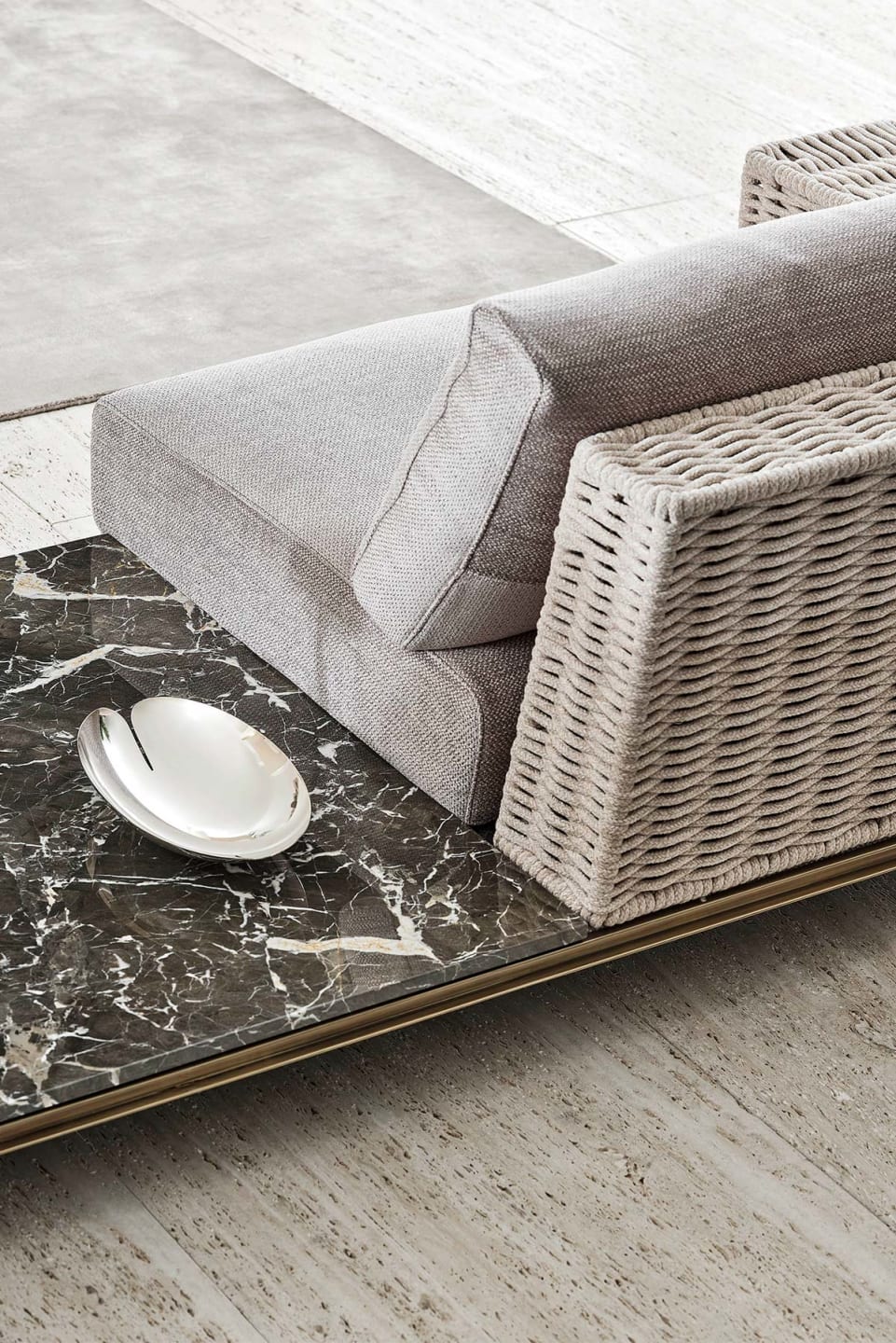 Memphis Intreccio sofa | Rugiano. Luxurious sofa with linear metal base, elegant leather details, and integrated marble coffee tables for versatile compositions.