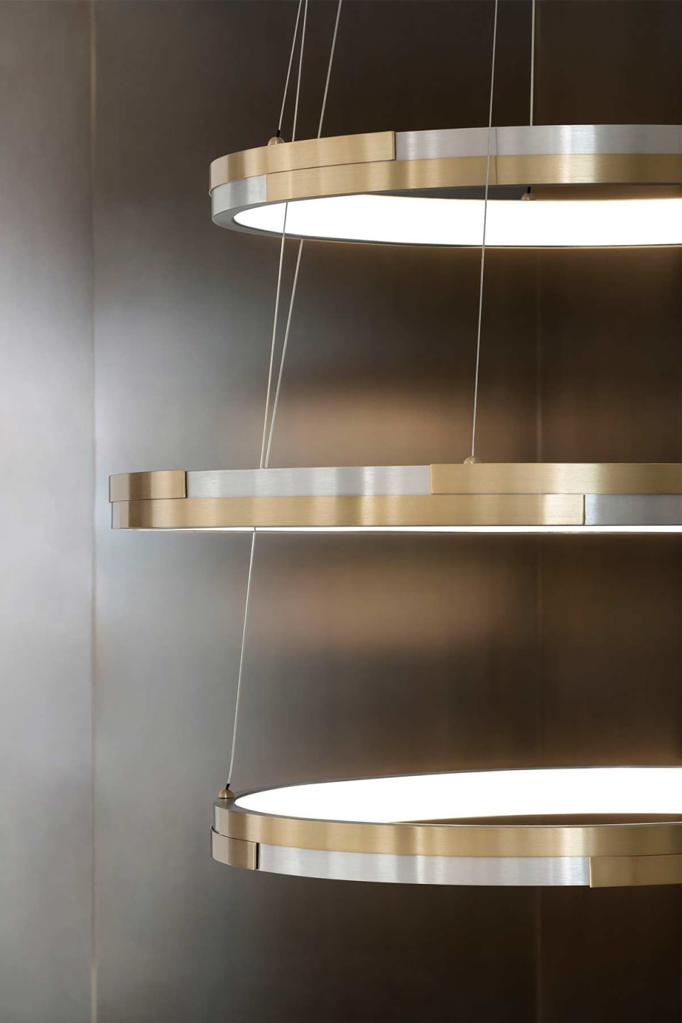 Trilogy pendant lamp | Rugiano. Modular pendant lamp in brushed aluminum or brass, creating unique lighting compositions.