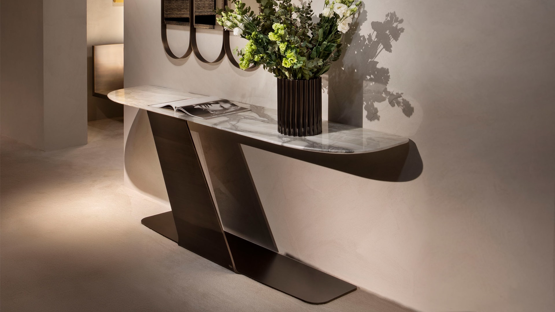 Wally console | Rugiano. Exquisite console with a marble top and unique geometric metal base.