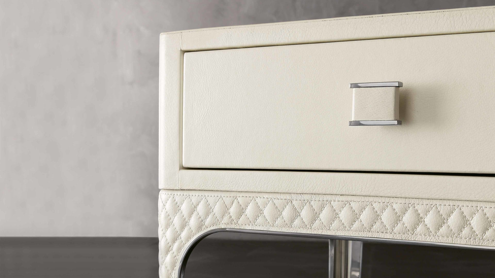 Charlie side table | Rugiano. A sleek, modern side table crafted with a unique textured top and elegant metal frame, perfect for sophisticated interiors.