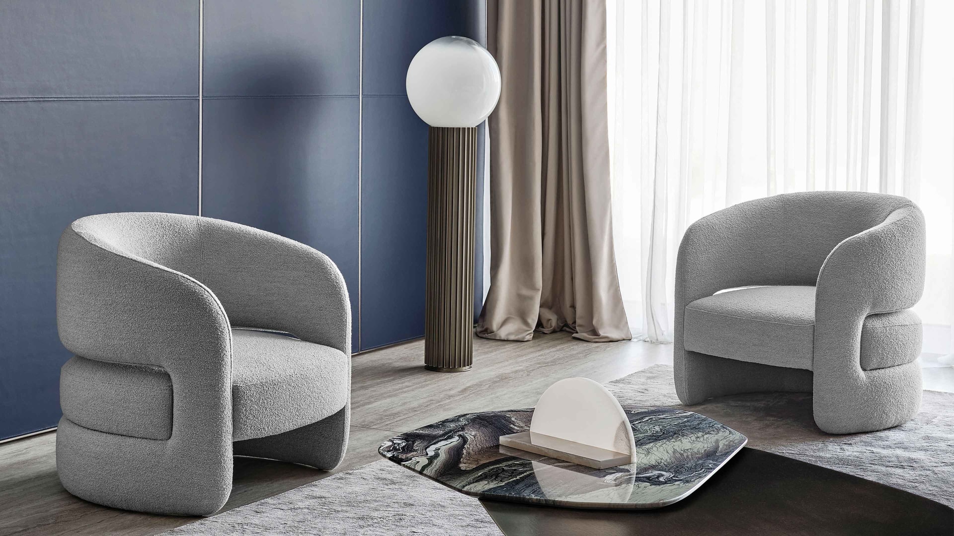 Ambra armchair | Rugiano. An armchair blending simplicity and sinuosity, offering comfort and a versatile contemporary touch for any interior.