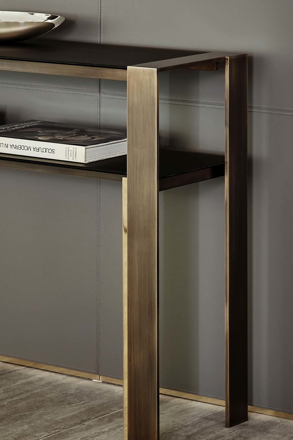 Pure console | Rugiano. Sleek console with clear-cut lines, featuring elegant glass tops and a sophisticated bronze structure.