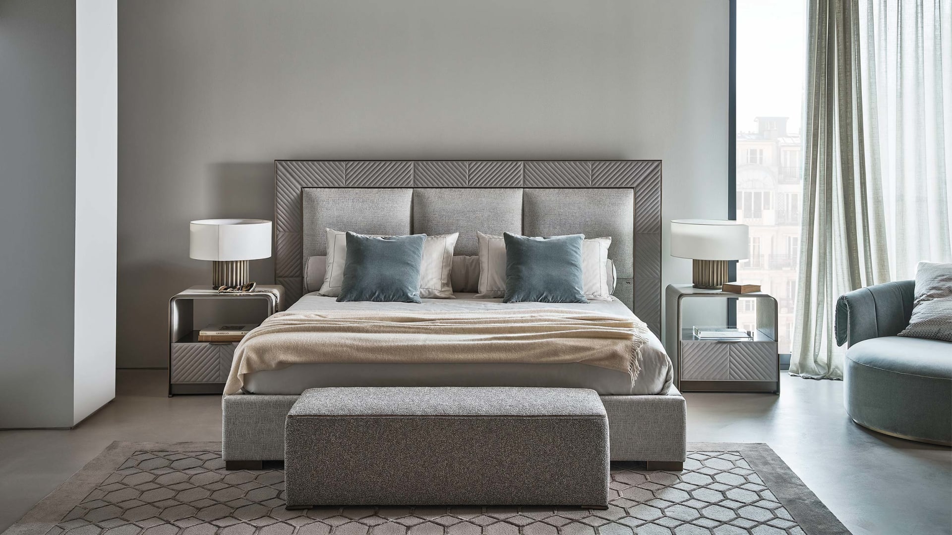 Aura Low bed | Rugiano. Sophisticated bed with padded headboard and frame, complemented by elegant metal details for contemporary interiors.