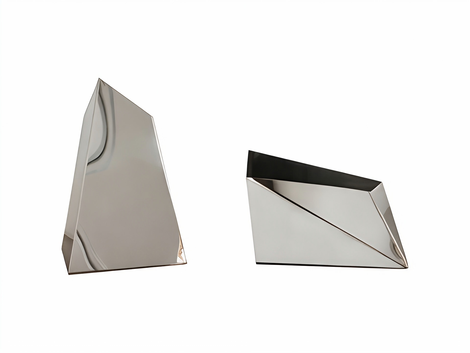 Prisma decorative object | Rugiano. Exquisite geometric decorative object crafted from polished metal, creating a captivating play of light and reflections.