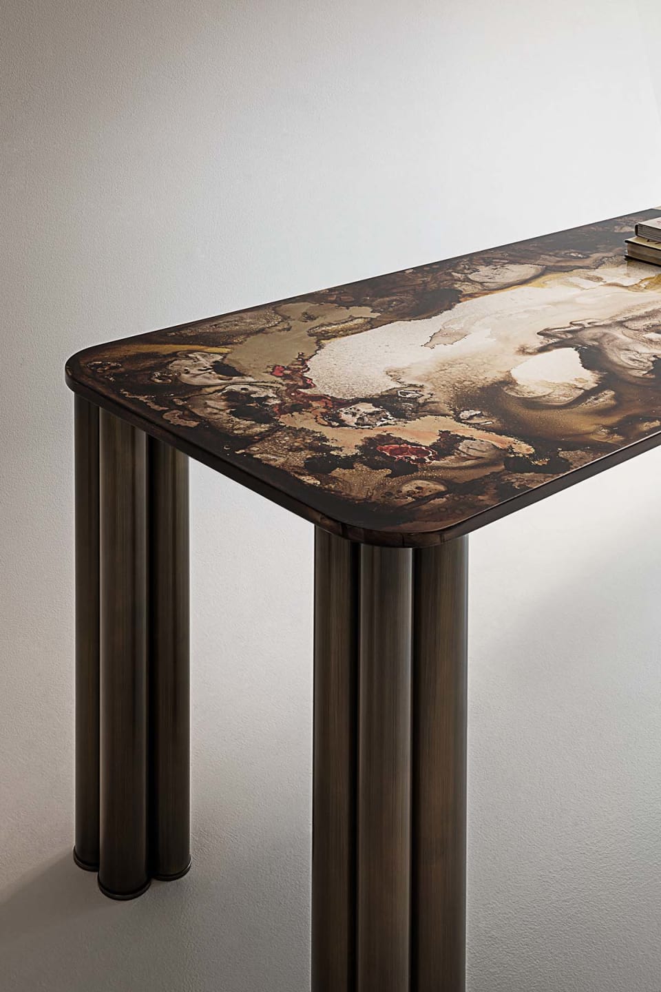 Forest console | Rugiano. Elegant console with filigree metal legs and a top available in wood, marble, or leather.