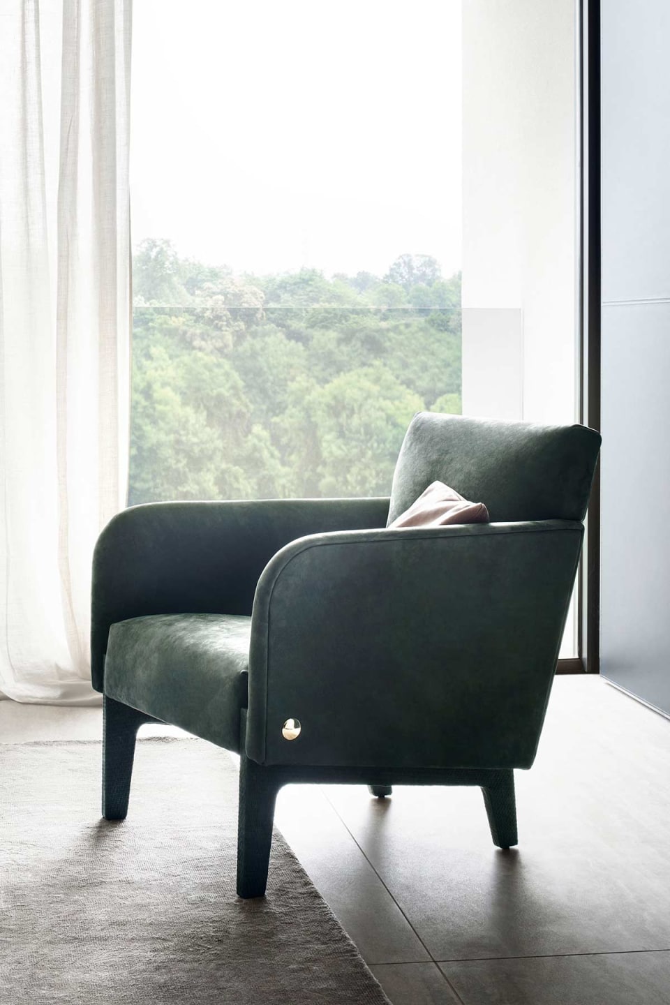 Agata armchair | Rugiano. Elegant armchair with upholstered legs and refined bronze details, offering luxurious comfort and sophisticated style.