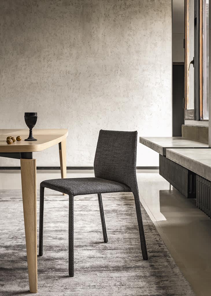 Corium chair | ALF Dafre. Compact designer chair with leather, fabric upholstery options and two backrest heights.