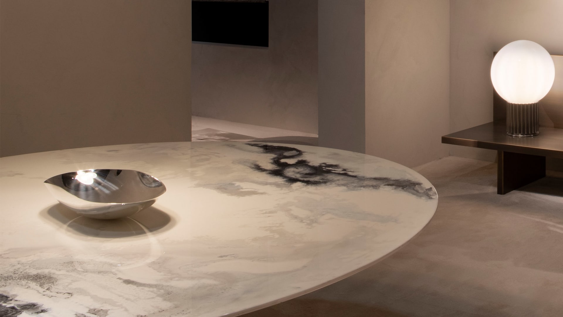 Blanco table | Rugiano. Sculptural table with a unique glass tabletop, rounded edges, and an expressive lacquered base, perfect for modern interiors.