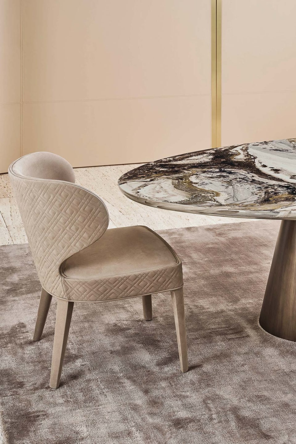 Aida armchair | Rugiano. An exquisitely designed upholstered chair with an optional high back and elegant wooden legs, offering versatile comfort.