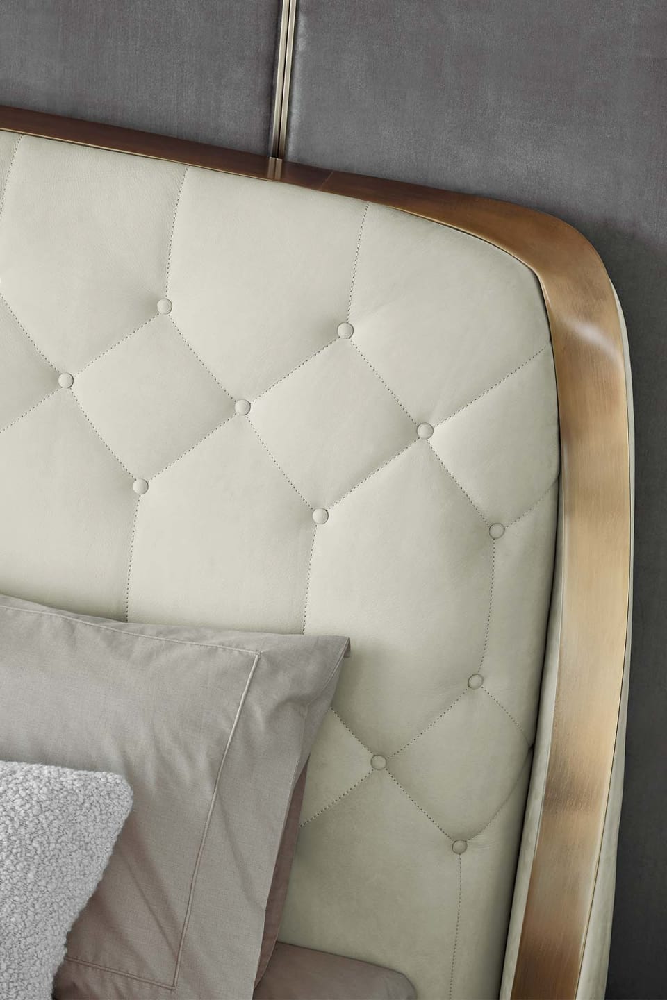 Damasse bed | Rugiano. Luxurious upholstered bed with a distinctive geometric headboard and sturdy metal frame.