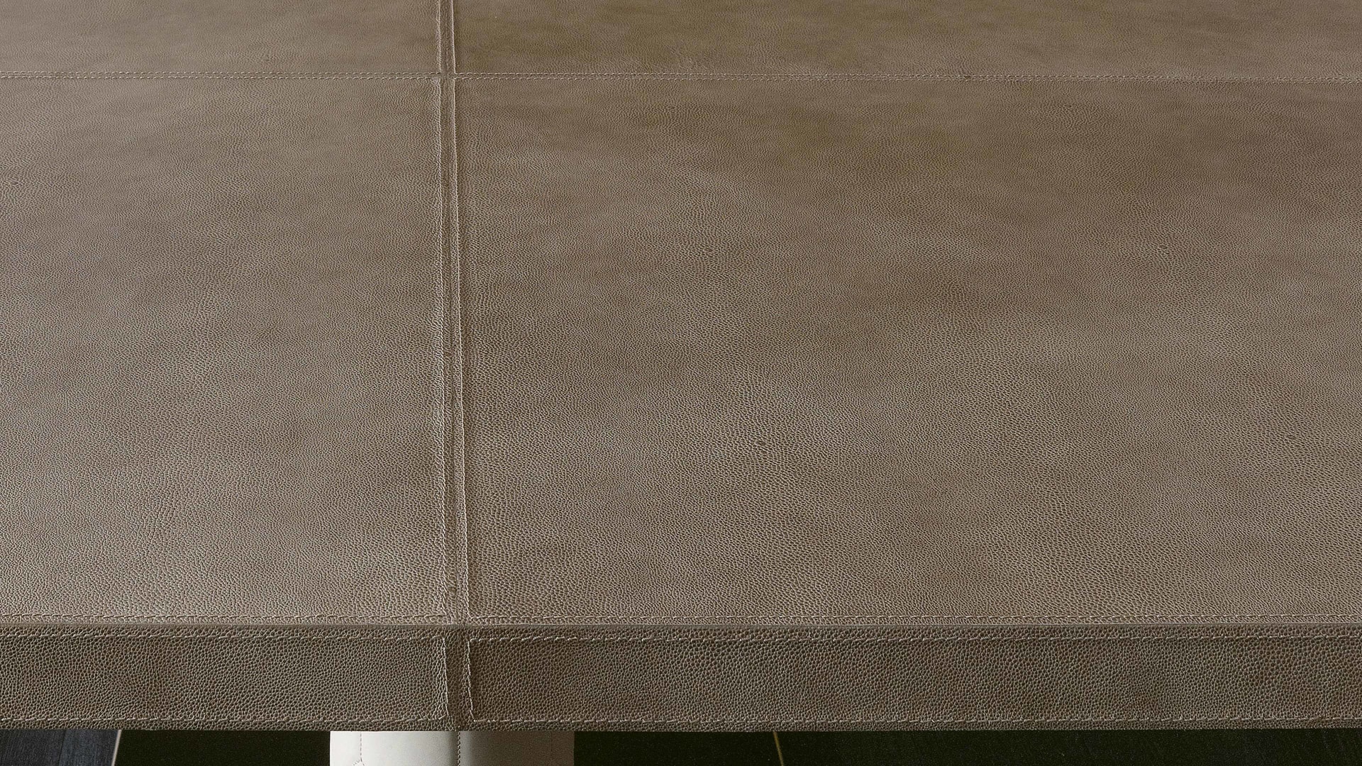Fujico table | Rugiano. Elegant dining table with a sleek lacquered top and two sculptural marble bases, offering two distinct sizes.