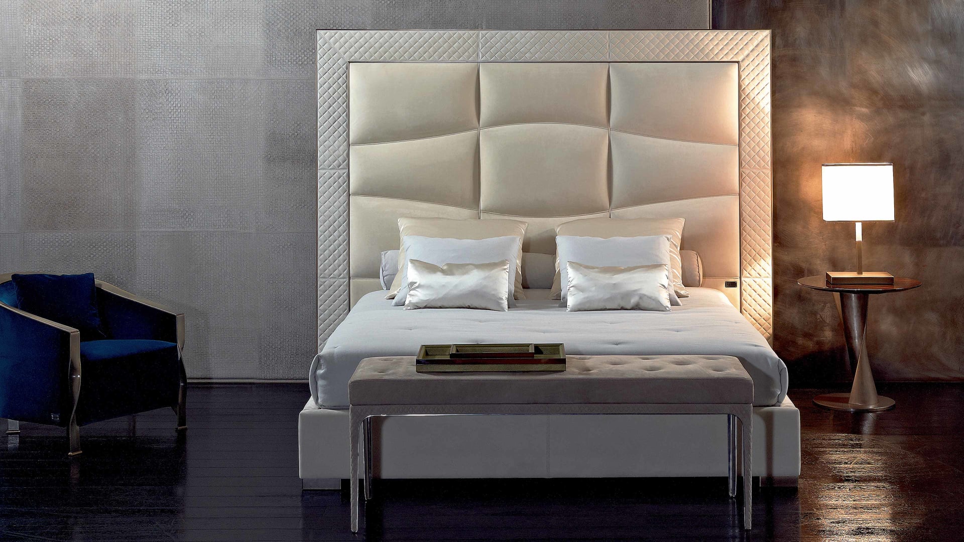 Onda bed | Rugiano. Elegant bed with a wave-patterned upholstered headboard, combining modern design and luxurious comfort.