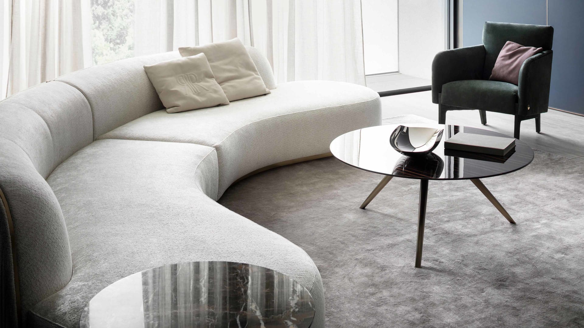 Agata armchair | Rugiano. Elegant armchair with upholstered legs and refined bronze details, offering luxurious comfort and sophisticated style.