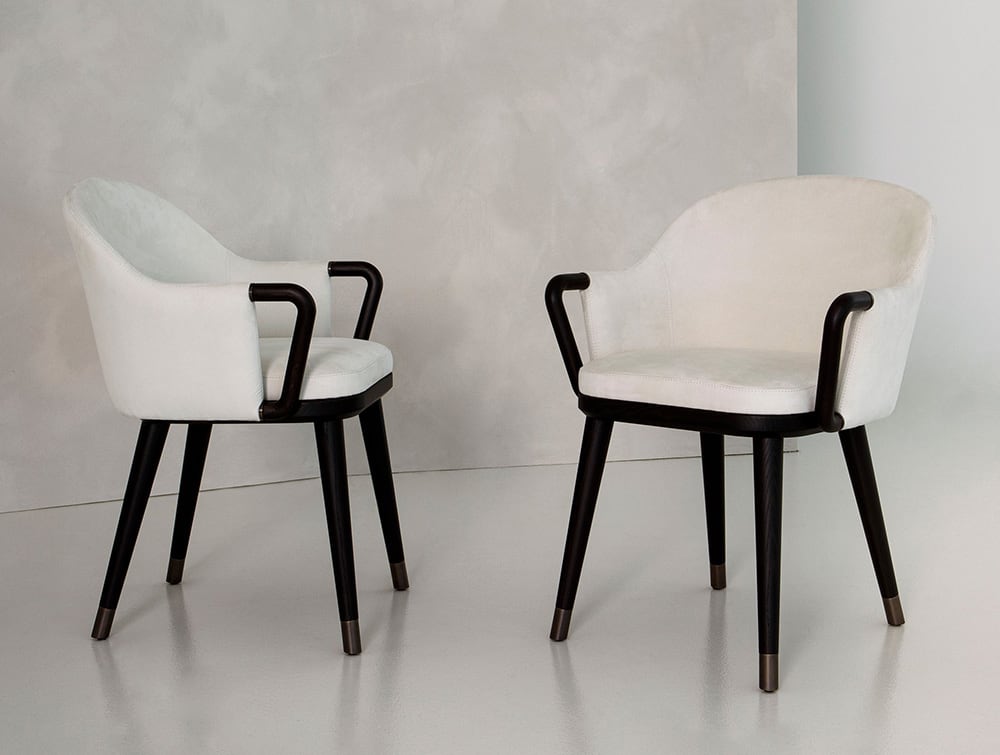 Camilla chair | Rugiano. Elegant upholstered chair with graceful curved lines, perfect for modern dining or sophisticated living spaces.