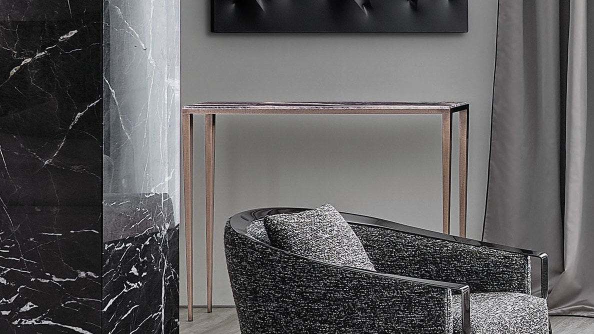 Dorotea console | Rugiano. Minimalist console with hammered bronze and marble tops, available in two sizes.