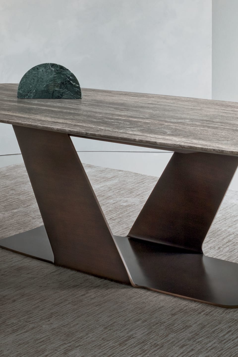 Wally table | Rugiano. A masterpiece of design, featuring a sculptural base and exquisite natural stone top, enhanced by distinctive decoration.